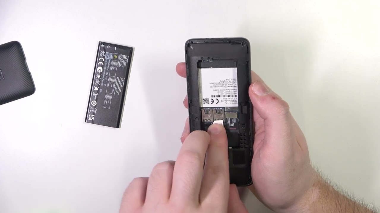 How to Insert SIM & SD Cards into a TCL onetouch 4042S - YouTube
