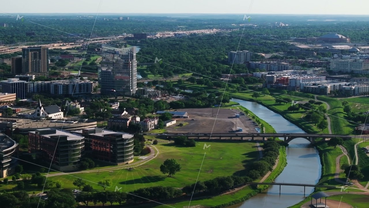 Aerial view of Fort Worth Trinity river, with green spaces, and modern architecture residential