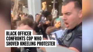 Black Officer Confronts Colleague Who Pushed Kneeling Protester | NowThis