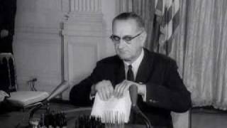 LBJ signs Civil Rights Act of 1964