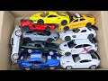 Box Full of Model Cars -Tesla Robotaxi, Tesla Cybertruck, Tesla Roadster, Lexus LC500, Lexus Lm 300h