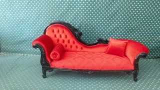 classic chaise lounge design with red velvet upholstery