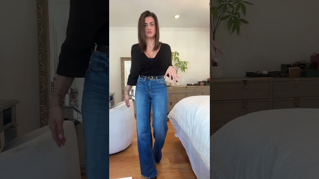 Black wrap ballet style sweater and jeans for a basketball game