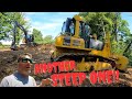 Excavating a road down a mountain with a John Deere Excavator and the Komatsu Bulldozer.