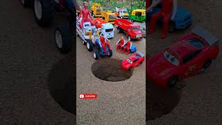 Red Sd Truck Near Ambulase Pushing Tractor And Mini Cars In To Pit Inside