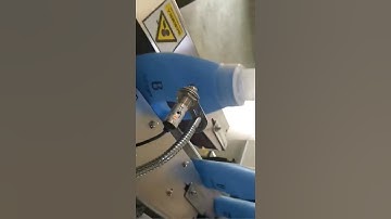 Printing bottom of moving bottles by Leadjet inkjet printing machine