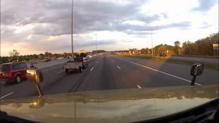 Bag falls off roof rack.