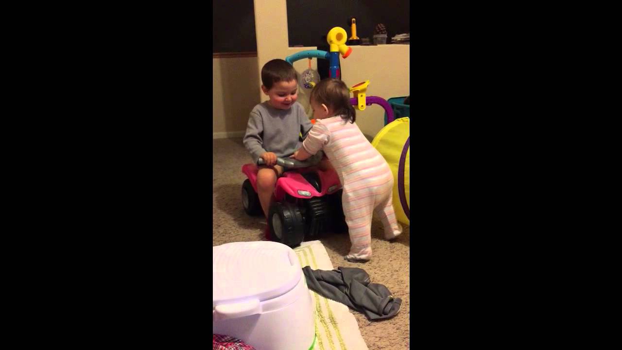 Adorable Big Brother Encourages Baby Sister To Walk