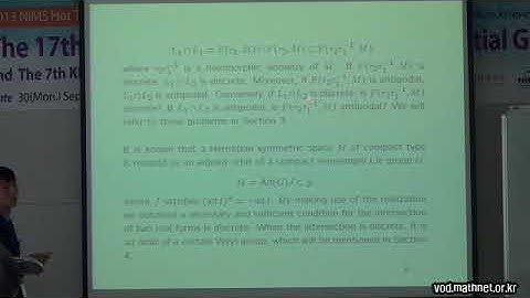 Fixed point sets of isometries and the intersection of real forms in a Hermitian symmertric space...