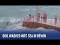 Devon footage shows moment girl is swept into the sea by huge wave