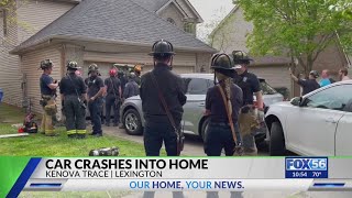Home damaged after parked car struck by another vehicle in Lexington neighborhood