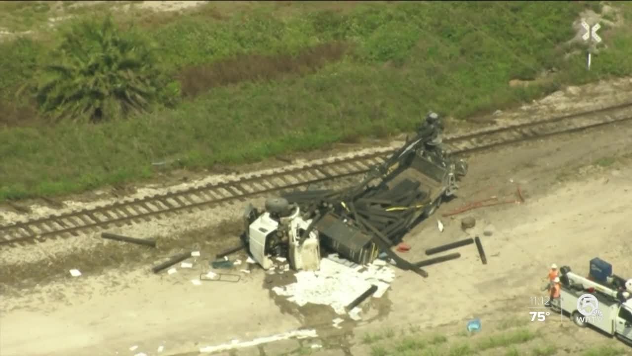 3 hurt after train hits truck in western Palm Beach County - YouTube