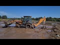 Retroescavadeira case 580N fechando taipa arrombada da lavoura de pré germinado