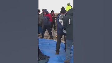 Soyuz spacecraft brings Russians, American back to Earth