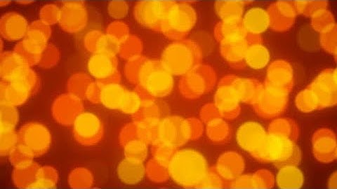 Golden Yellow and Orange Glitter Bokeh Background stock footage | stock video | Cinefootage