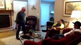 Grandpa slaps grandson with hambone