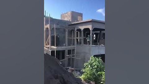 Rough cast Rendering cement mortar. Dump and  Leveling drive way.