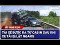 Bắc Trung Bộ 24H: Tài xế bước ra từ cabin sau khi xe tải bị lật ngang