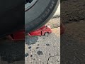 Car Tire Crushes Mini Car