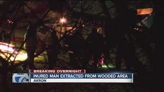 Crews rescue a man stuck in the woods in Akron