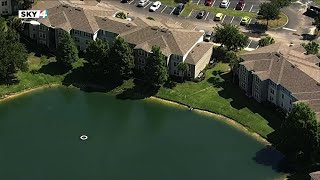 Child pulled from pond at apartment complex