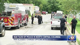 Police: Man subdued after charging officers with knife