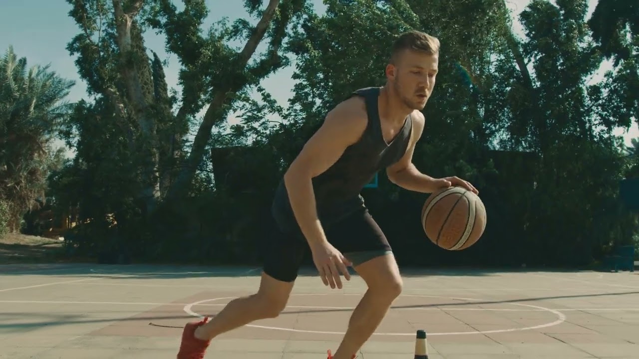 VideoVault Stock Video: Basketball player practicing dribbling