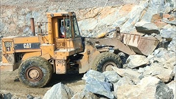 Heavy machine rocks loading in action; caterpillar loader 966D big rocks loading trolleys#video#cat