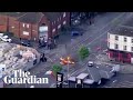Aerials from Belfast during anti-immigration protest following knife attack – watch live