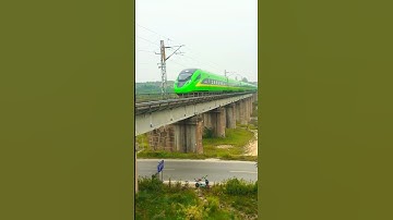 High-Speed Green Train Zooms Over Bridge! #Shorts