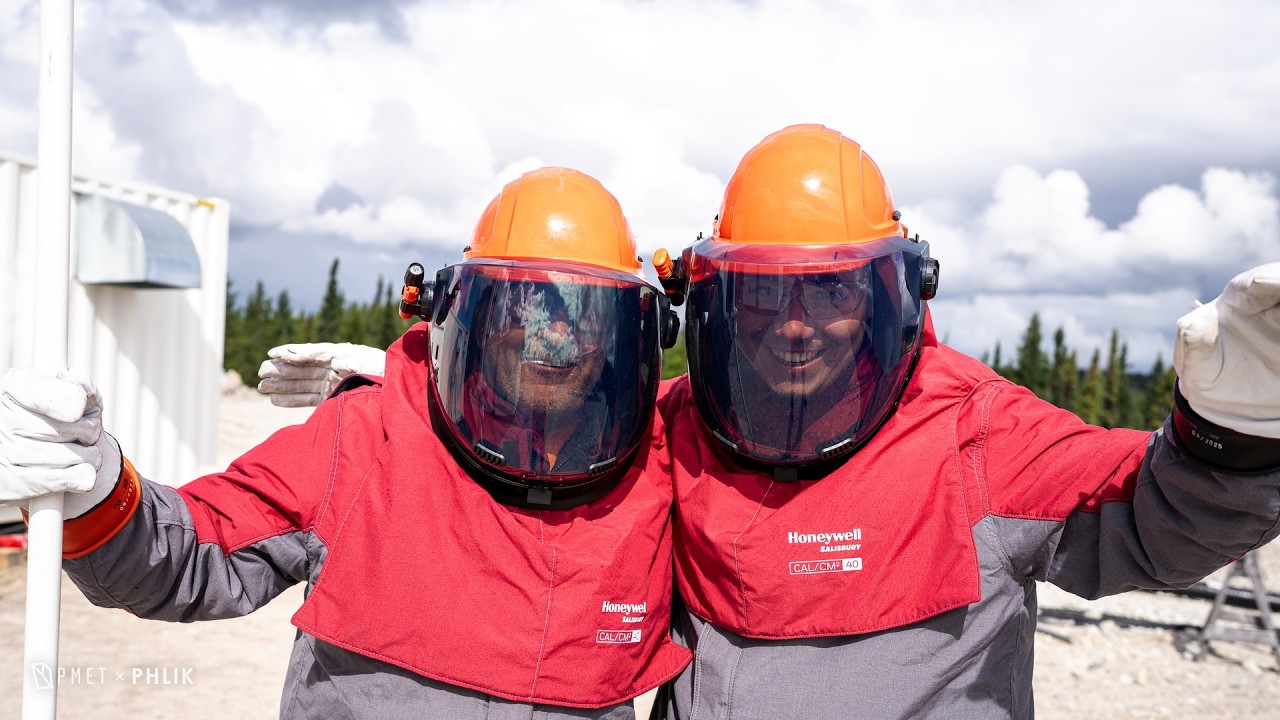 Samuel Dulac and a colleague in arc-flash suits