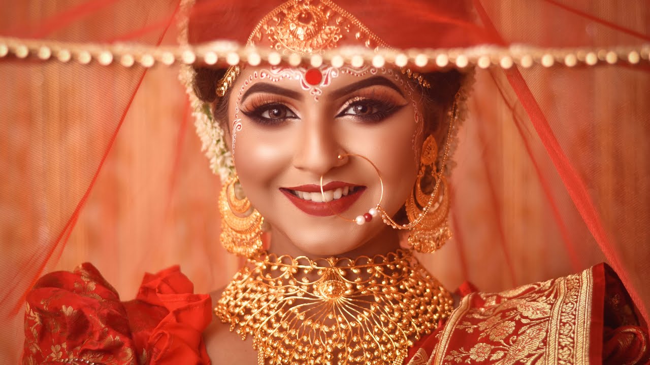 Premium Photo | A bride poses for a photo in her traditional bridal gown.