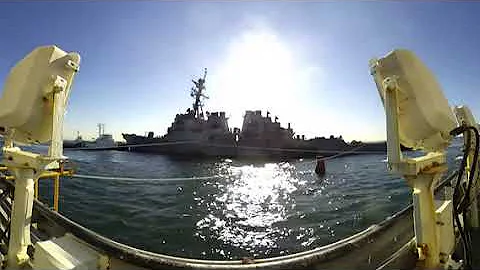 USS John S. McCain is lowered from heavy lift MV Treasure