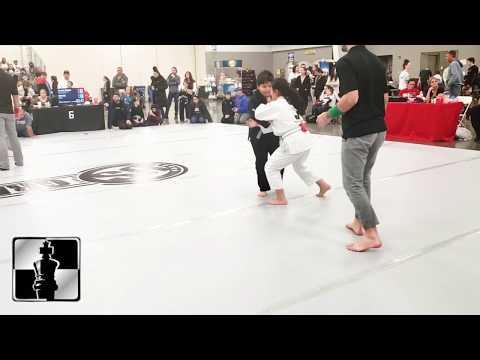 Kids BJJ Tourney HL Finish - Girl Finishes Larger Boy via Drop Seoi Nage to Armbar