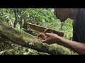 Making a fire with bamboo and wood friction.Fire Saw