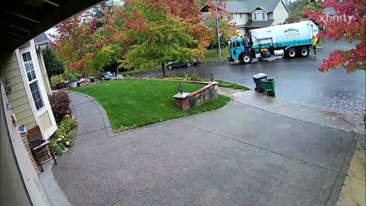 Labrie automizer on recycling ( my neighbors, garbage can lid fell into