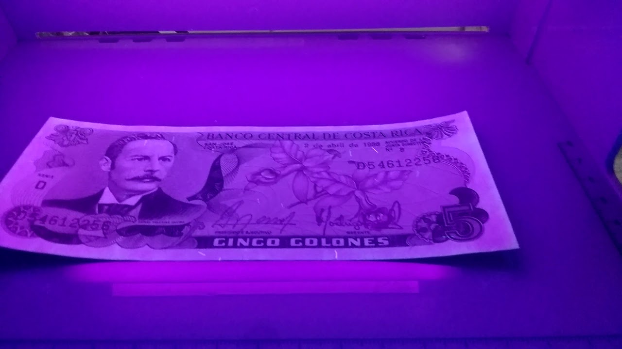 банкноты в ультрафиолете. денежные знаки под ультрафиолетом. светящиеся банкноты. купюра в ультрафиолете. светящиеся банкноты.