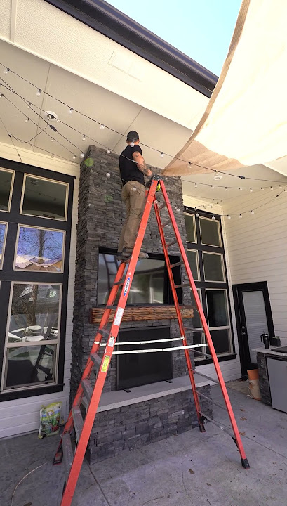 Installing Triangle Sail Shade On Backyard Patio