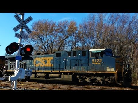 bnsf 5729 Fast CSX Manifest Train at Railroad Crossing 4K
