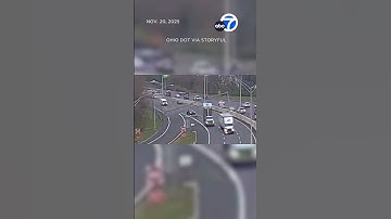 Shocking moment dump truck collides with overhead signage