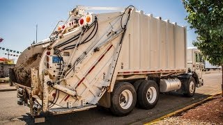Leach 2Rii Rear Load Garbage Truck Collecting Commercial Dumpsters
