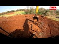 Serviço de destoca de eucalipto e arrancando pedras com Escavadeira Hidráulica (parte 2)