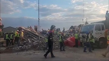 Rescuers search for missing dozens after building collapse in South Africa