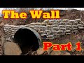 The Wall - Part 1:  Building a wall of concrete bags on the upstream end of a washed-out culvert.