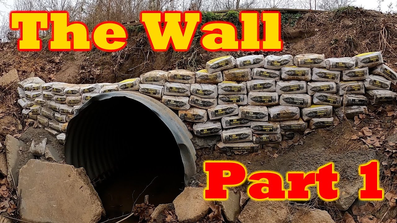 The Wall Part 1 Building a wall of concrete bags on the upstream end