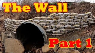 The Wall - Part 1:  Building a wall of concrete bags on the upstream end of a washed-out culvert.