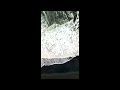 Stunning overhead drone shot of black sand beach and waves, southern Icleand