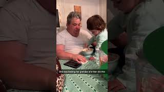 Kid Pranks Grandpa While Helping Him Eat