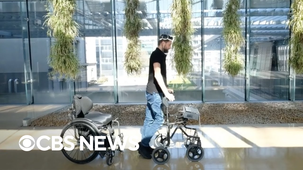 Paralyzed man can walk again with brain with spinal cord implants