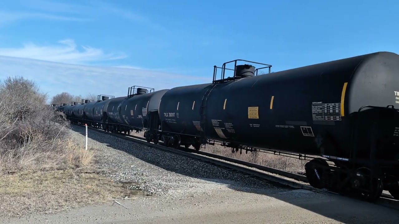 An Ohio Central manifest is taking the siding to go around a work zone on the mainline.
